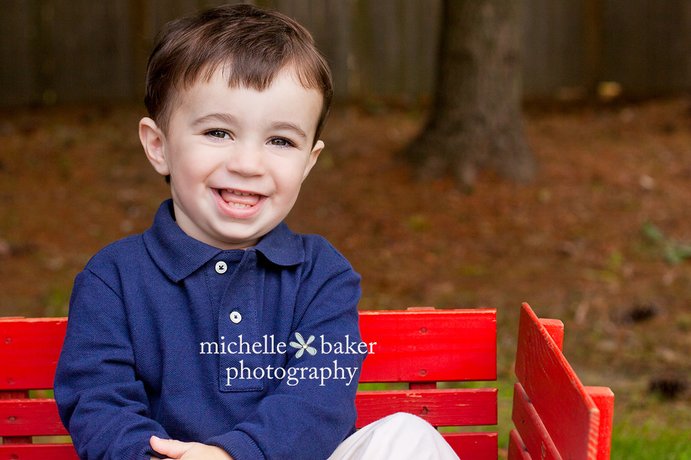 Little boy in a red wagon