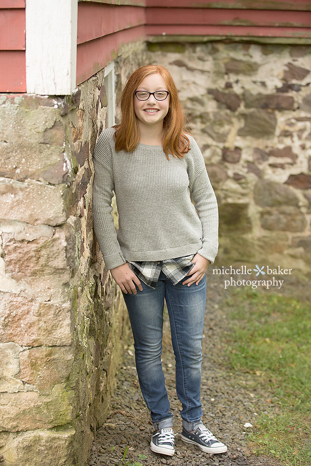 Tween girl by wall