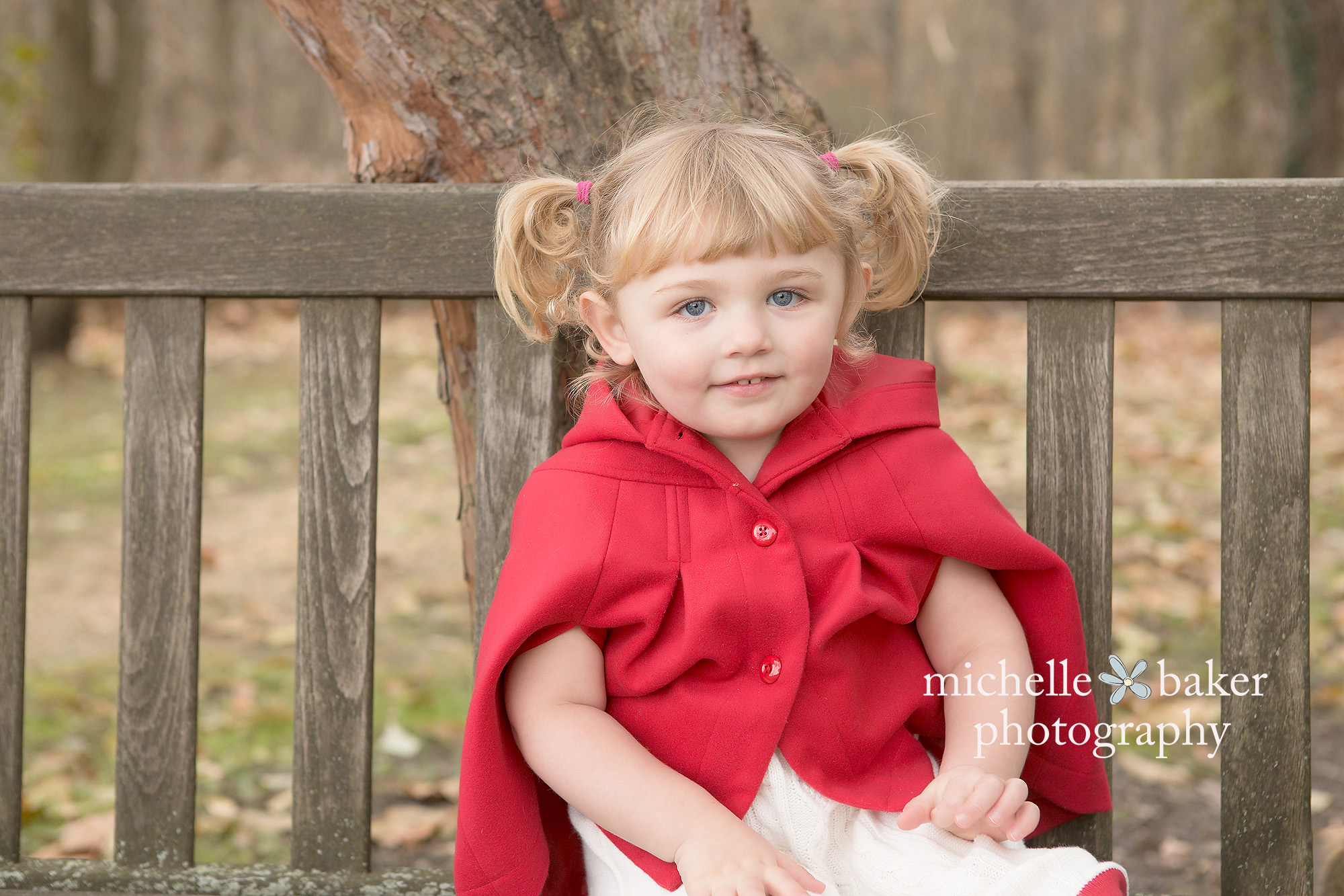 Twin girl with red riding hood coat