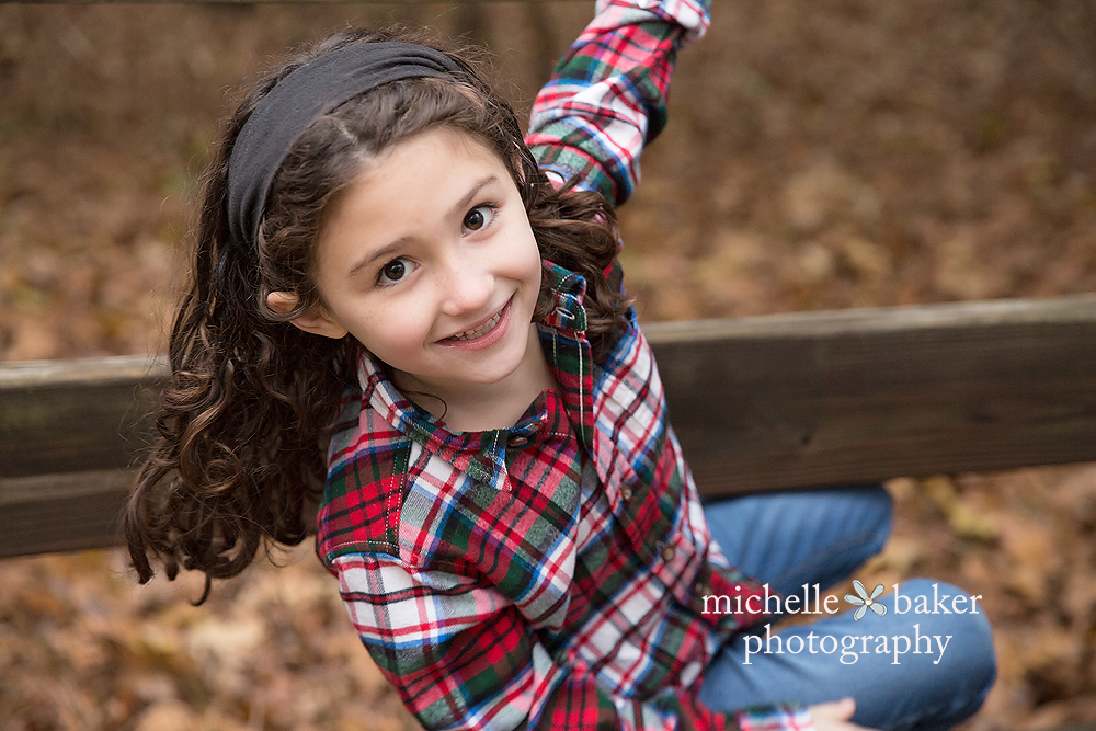 adorable girl on fence